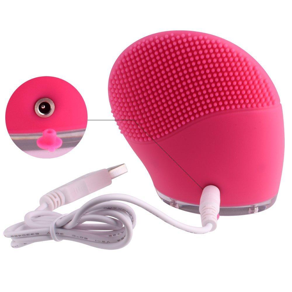 Ultrasonic Facial Cleansing Brush in pink with charging cable, ideal for skin massage and cleansing routine.